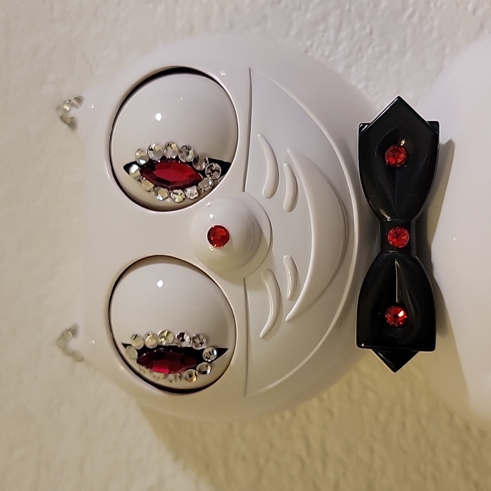 Jeweled White Kit-Cat Klock clock with black bow tie and tail